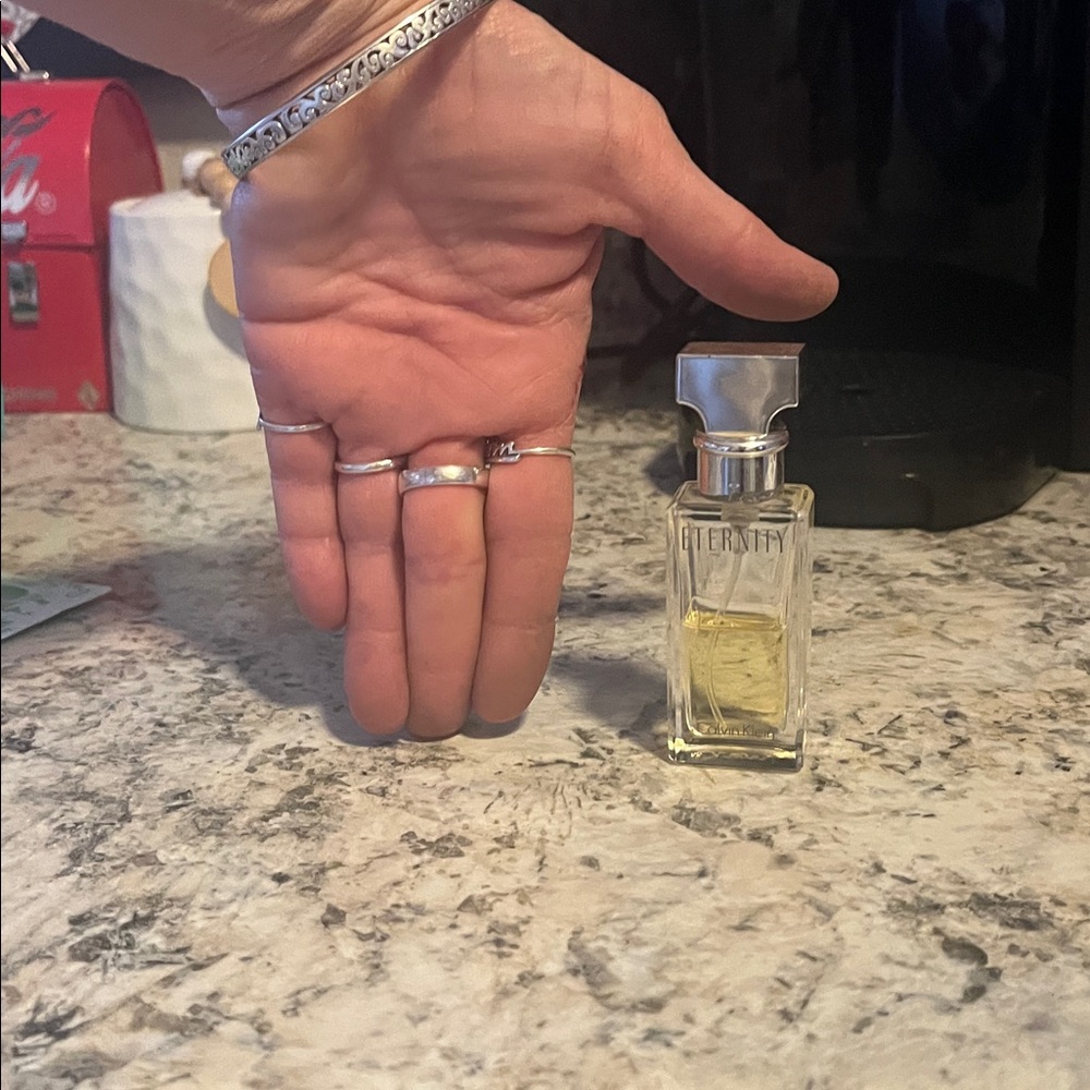 eternity Calvin Klein Clear Glass Perfume with Silver Cap. HALF FULL - Picture 2 of 2